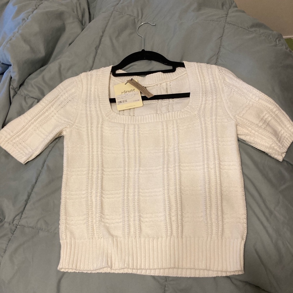 Cream/white square neck sweater with short sleeves.